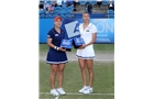 EASTBOURNE, ENGLAND - JUNE 21:  Hao-Ching and Yung-Jan Chan of Chinese Taipei poses with the trophy after beating Martina Hingis of Switzerland and Flavia Pennetta of Italy during their Women's Doubles Finals match on day eight of the Aegon International at Devonshire Park on June 21, 2014 in Eastbourne, England. (Photo by Jan Kruger/Getty Images)